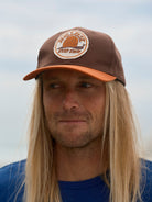 snail-patch-hat-brown-orange - description
